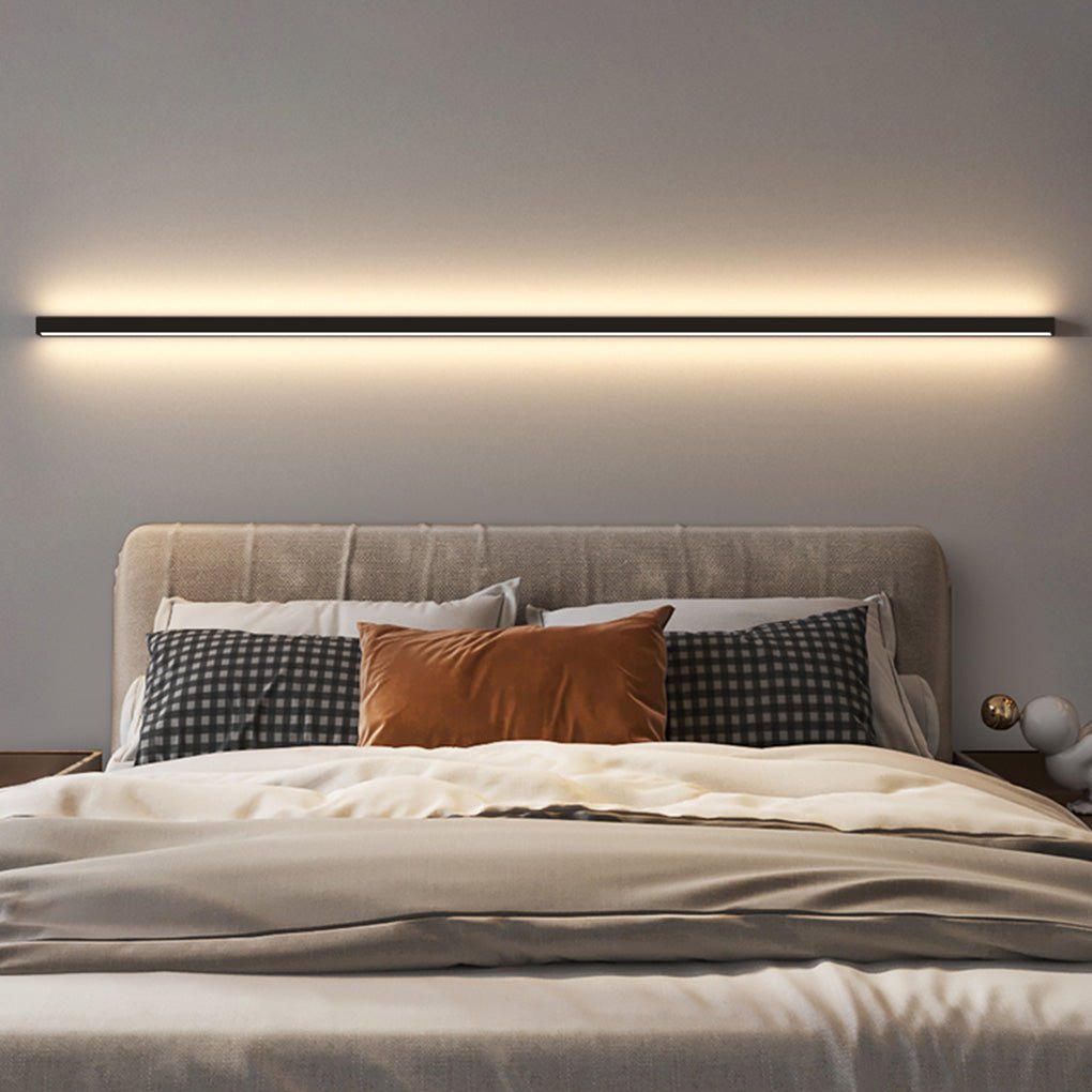 Minimalist linear wall sconce casting ambient light