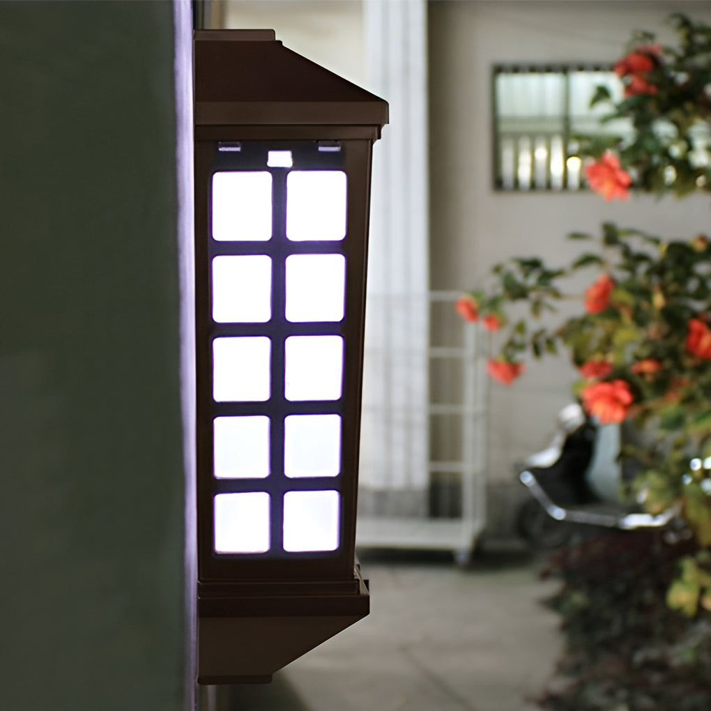 Solar light outdoor wall close-up showing illuminated grid design and warm LED glow at night.