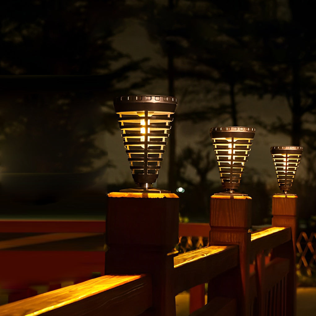 Solar torch light with a modern design, enhancing a landscaped garden.