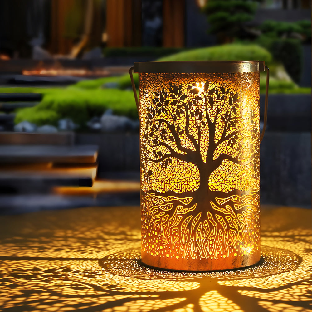 Tree of life lantern illuminating a patio with elegant, intricate patterns.